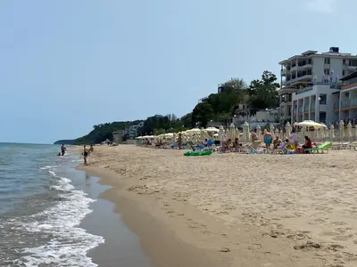 a beach with a lot of people on it at Зора-Обзор in Obzor