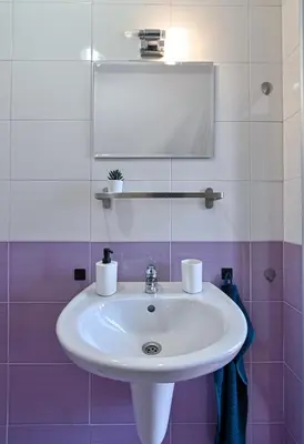 a white sink in a bathroom with a mirror at Via Sunride 2 - Maisonette Apartment by the sea in Sozopol