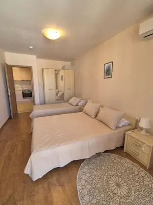 a bedroom with two beds in a room at Апартамент в отеле Premier Fort Beach in Sveti Vlas
