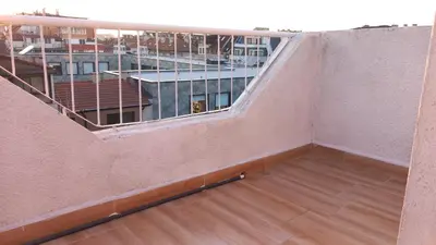 an empty room with a staircase in a building at Апартамент Плажен рай in Burgas City