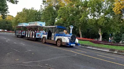 a small train driving down a road at Апартамент Плажен рай in Burgas City