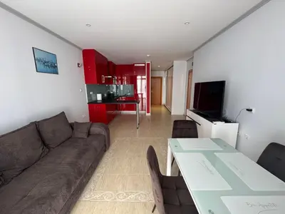 a living room with a couch and a table at Diamond by the Sea in Sveti Vlas