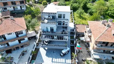 an aerial view of a house with a car in the yard at Холидей Обзор-Стая in Obzor