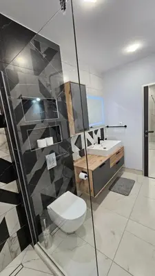 a bathroom with a toilet and a sink at Холидей Обзор-Стая in Obzor