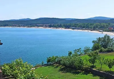 a view of a beach and a body of water at Paradise apartment Sozopol in Sozopol