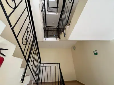 an overhead view of a staircase in a house at Rose Village Apartment in Sunny Beach