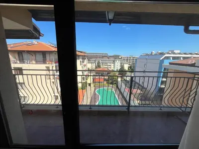 a view of a balcony from a window at Rose Village Apartment in Sunny Beach