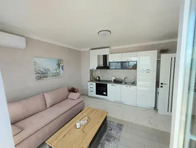 a living room with a couch and a table at Sofi's Harmony in Burgas City
