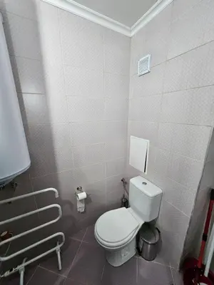 a bathroom with a white toilet in a stall at Tropical Chic for Two, Basement Studio Escape by Flat Mаnager in Ravda