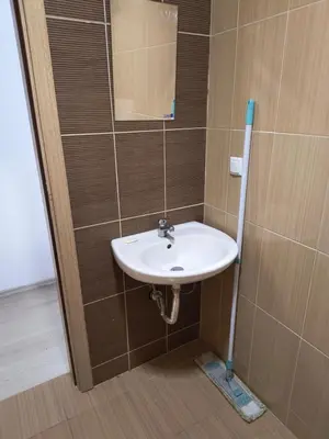 a bathroom with a white sink and a mirror at Apartment Sunny View Central in Sunny Beach