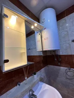 a bathroom with a sink and a mirror at The Sunny Spot in Sunny Beach