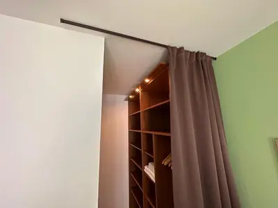 a room with a closet with a curtain at The Sunny Spot in Sunny Beach