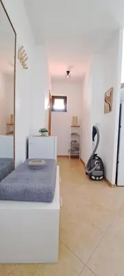 a bedroom with a bed and a black object on the floor at Royal sun in Sunny Beach
