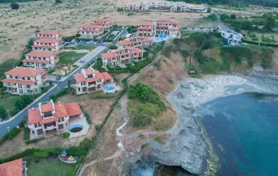 a group of houses on a hill next to the ocean at Appart complex - Egrek 5 in Lozenets