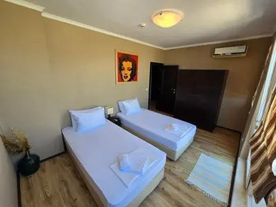 a small room with two beds in it at Sea View Luxury Penthouse in Sunny Beach