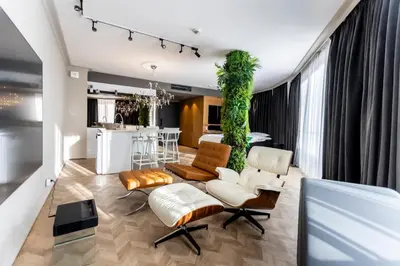 a living room with a couch and chairs and a table at Arena MALL Galleria & Parking 4 in Burgas City