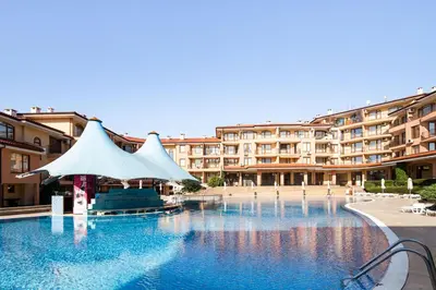 a large swimming pool in front of a large building at Panorama Dreams - Prestige Apartments in Sveti Vlas
