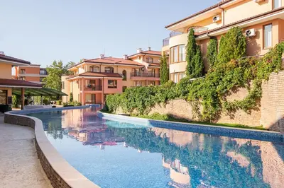 a swimming pool in front of some buildings at Panorama Dreams - Prestige Apartments in Sveti Vlas