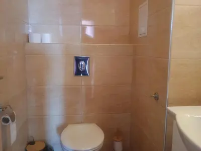 a bathroom with a toilet and a shower at Barbie-Themed 3BDR Penthouse Near The Beach, Nessebar in Nesebar