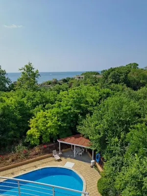 an overhead view of a swimming pool and trees at Sineva Apartments in Ravda