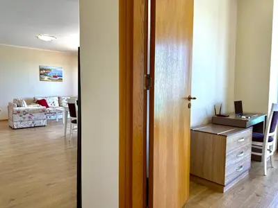 an open door to a room with a desk at Cosher - Gardenia Palace Apt 10 Free Parking in Pomorie