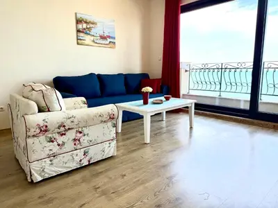 a living room with a couch and a table at Cosher - Gardenia Palace Apt 10 Free Parking in Pomorie