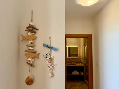 a room with a wall with some decorations on it at Cosher - Gardenia Palace Apt 7 Free Parking in Pomorie