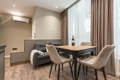 a dining room with a table and chairs at City Center Luxury Studio in Varna City