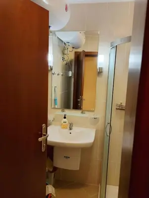 a bathroom with a sink and a mirror at Garden of Eden - Panorama C2 in Sveti Vlas