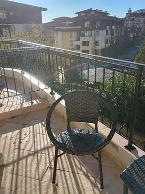 a chair sitting on top of a balcony at Garden of Eden - Panorama C2 in Sveti Vlas
