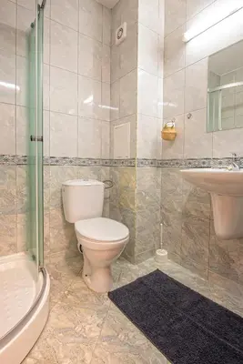 a bathroom with a toilet and a sink at Stylish Holiday Apartments in Karolina in Sunny Beach