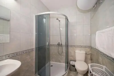 a bathroom with a shower and a toilet and a sink at Stylish Holiday Apartments in Karolina in Sunny Beach