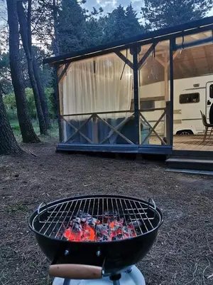 a barbecue grill in front of a camp site at The magical place in Chernomorets