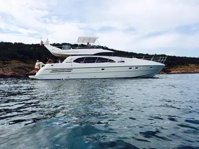 a white boat in the water with people on it at Azimut in Nesebar