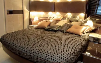 a large bed in a room with lights on it at Azimut in Nesebar