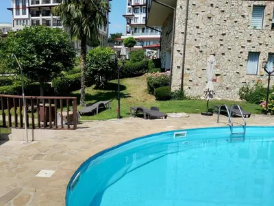 a large swimming pool in front of a building at Етъра - 2 Rey&Mar Свети Влас in Sveti Vlas