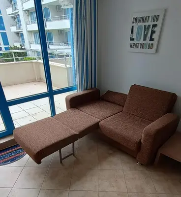 a waiting room with a bench in front of a window at Excelsior Prince ApartHotel in Sunny Beach