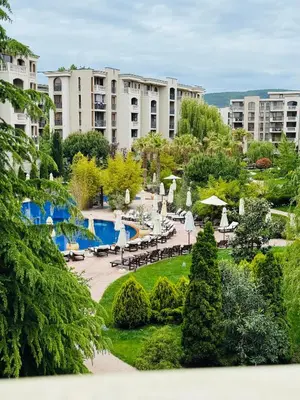a view of a resort with a pool and buildings at Апартамент Каскадас in Sunny Beach