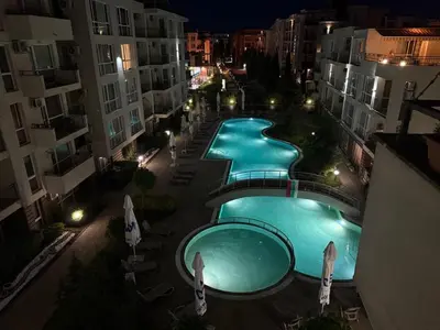 an overhead view of two swimming pools at night at Apartament Casa del Sol no 115 in Sunny Beach
