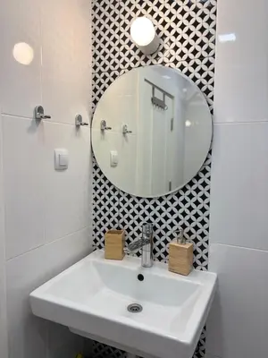 a bathroom with a sink and a mirror at Cozy Corner in Varna - Free Parking in Varna City