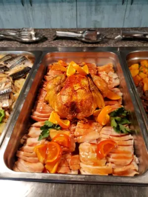 a tray of food with a chicken and other foods at Grenada Complex All Inclusive in Sunny Beach