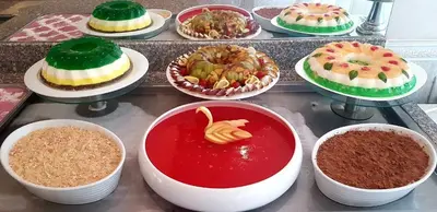 a bunch of different types of cakes on a table at Grenada Complex All Inclusive in Sunny Beach