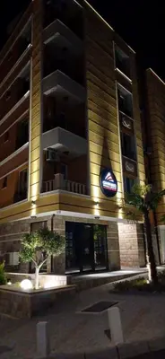 a building with a sign on the side of it at Апартамент Габи 1 in Burgas City