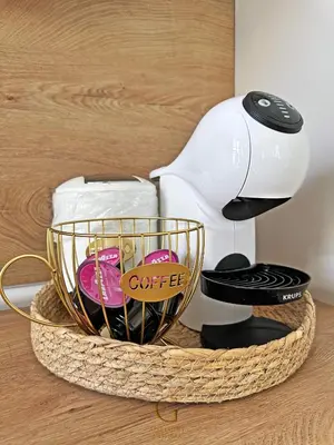 a coffee maker sitting on top of a table at Villa Roma Gs' Apartment in Nesebar