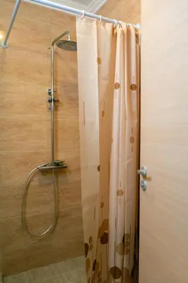 a shower with a shower curtain in a bathroom at Villa Roma Gs' Apartment in Nesebar