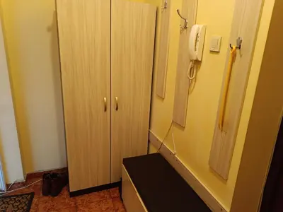 a room with a telephone next to a cabinet at Апартамента на центъра на Варна до фонтаните in Varna City
