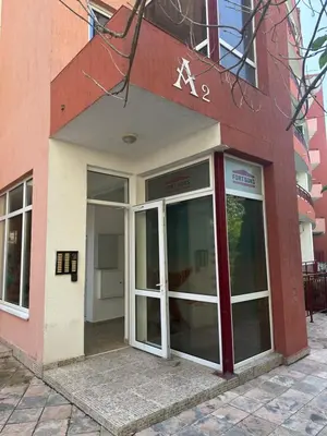 an entrance to a building with a revolving door at Amartmán přímo u moře - Elenite in Sveti Vlas
