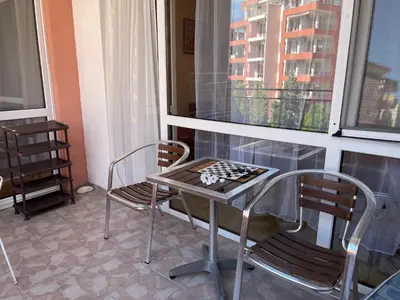 a table and two chairs in a room with a window at Amartmán přímo u moře - Elenite in Sveti Vlas