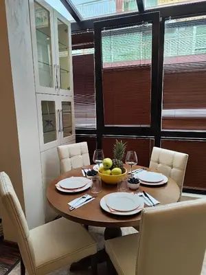 a dining room table with a bowl of fruit on it at Villa Alva in Pomorie