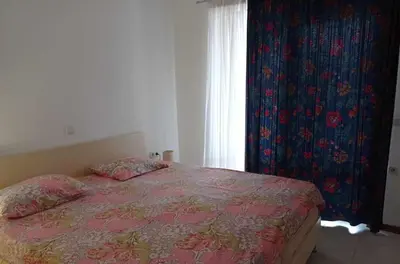 a bedroom with a bed and a window at Апартаменти за гости Морска гледка in Chernomorets